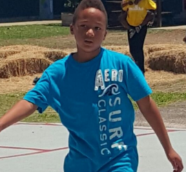 African American teen wearing a blue t-shirt