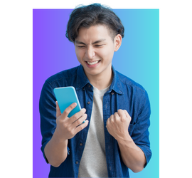 Asian teen male wearing a blue jean shirt with a cream colored shirt underneath holding an iPhone