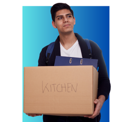 Hispanic male holding a cardboard box that says kitchen on it